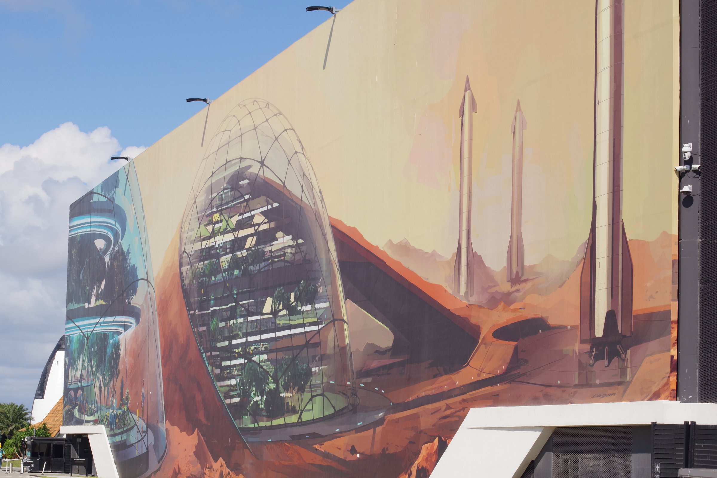 Close view of Mars colony mural showing domes and Starships on a painted landscape